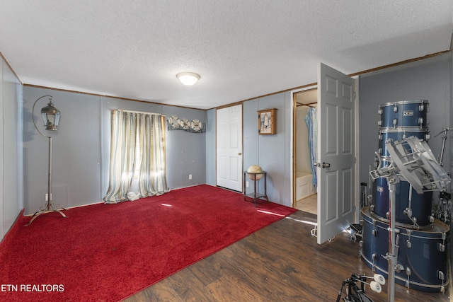 entrance foyer featuring dark hardwood / wood-style flooring and a textured ceiling