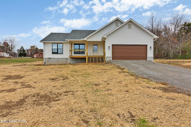 view of front of home featuring covered porch and a garage