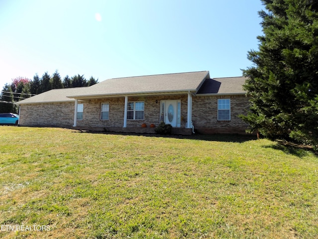 ranch-style home with a front lawn