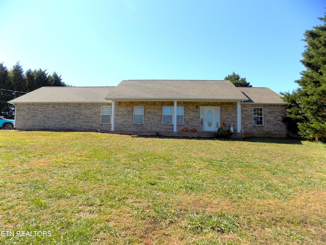 ranch-style house featuring a front lawn