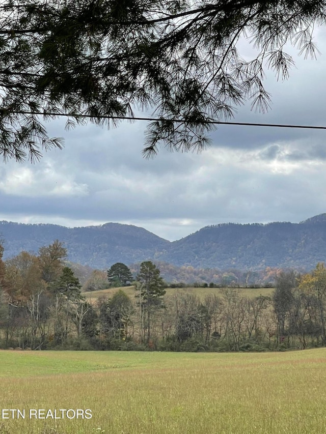 property view of mountains featuring a rural view