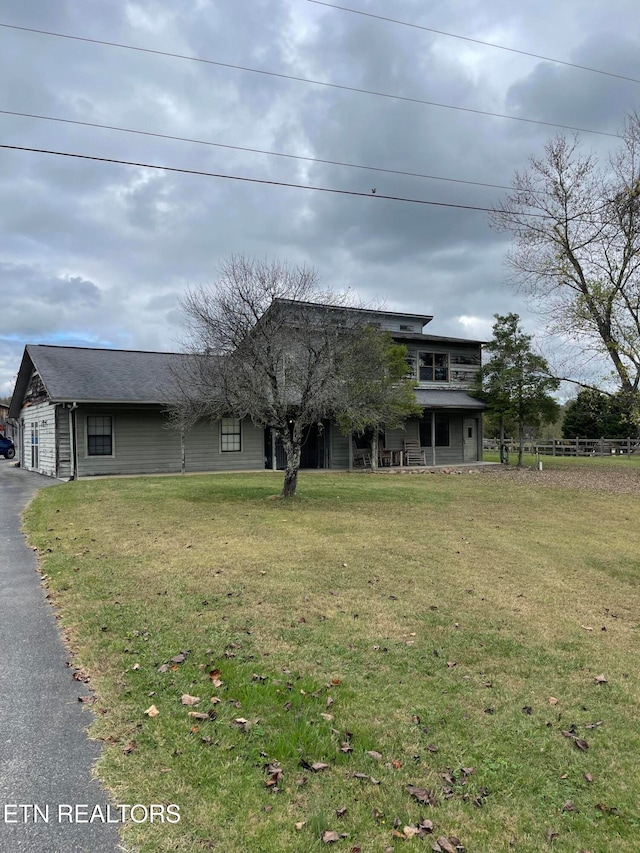 view of front of home with a front yard