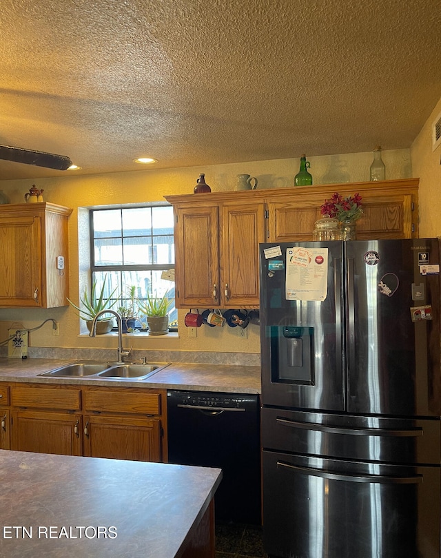 kitchen with black dishwasher, stainless steel refrigerator with ice dispenser, a textured ceiling, and sink