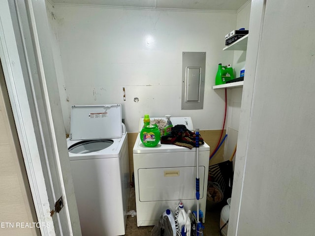 laundry area featuring electric panel and washing machine and dryer