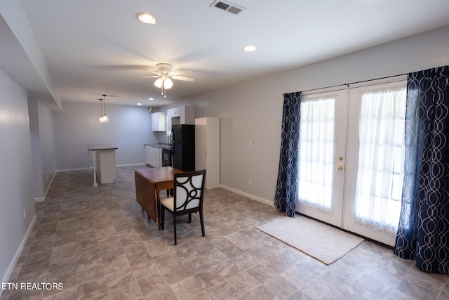 dining space with french doors and ceiling fan