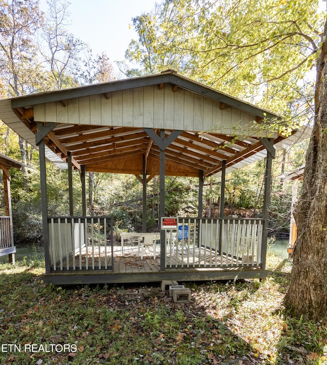 view of community with a gazebo and a deck