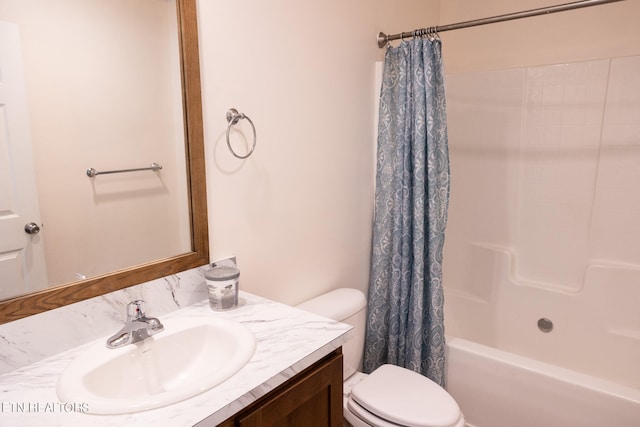 full bathroom with vanity, shower / bath combination with curtain, and toilet