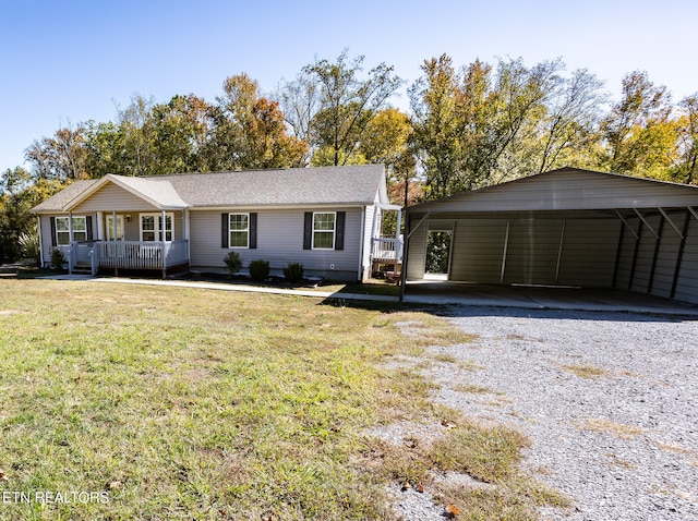 ranch-style house featuring a front lawn and a carport