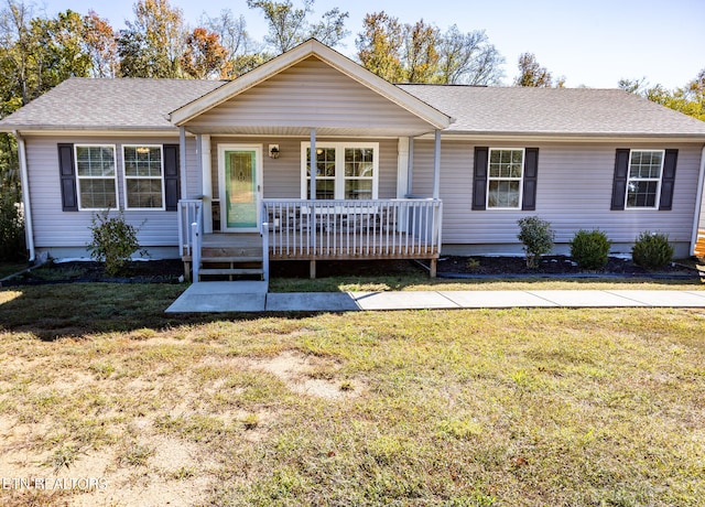 ranch-style house with covered porch and a front lawn