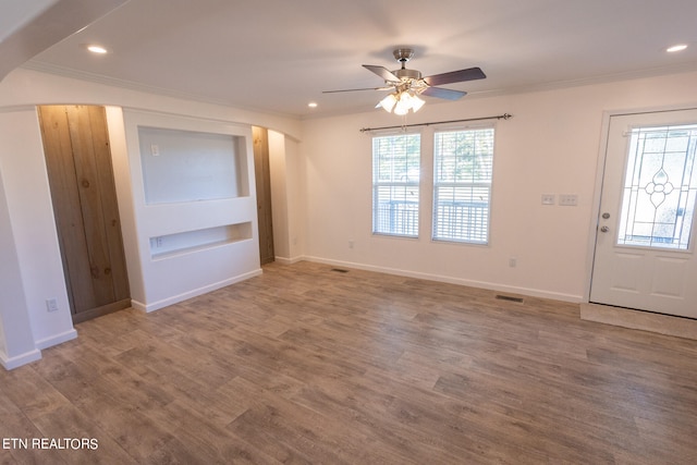 foyer entrance featuring a healthy amount of sunlight and hardwood / wood-style flooring