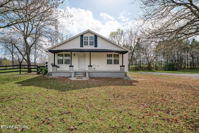 view of front of house with a porch and a front lawn