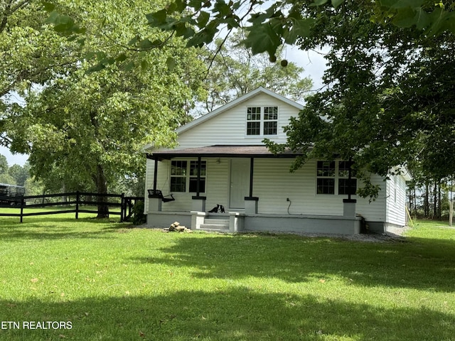 view of front of home featuring a porch and a front yard