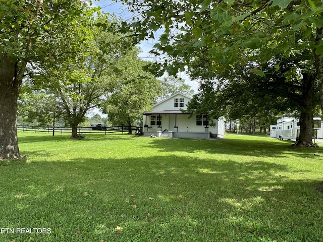 view of yard featuring covered porch