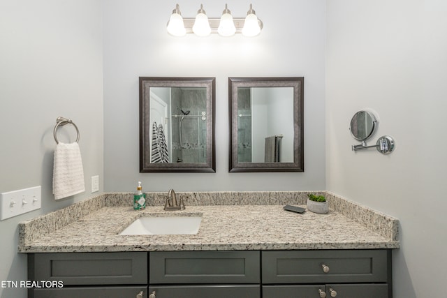 bathroom with vanity and walk in shower