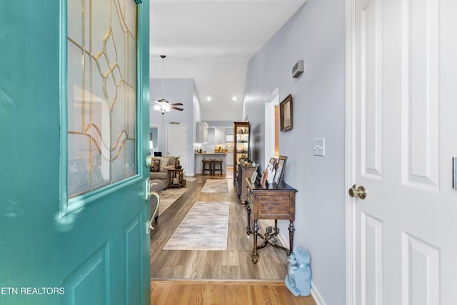 entryway with light wood-type flooring and ceiling fan