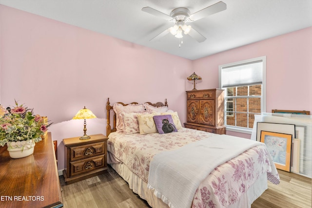 bedroom featuring light hardwood / wood-style flooring and ceiling fan