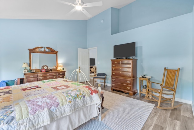 bedroom featuring lofted ceiling, wood-type flooring, and ceiling fan