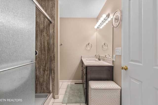 bathroom featuring vanity, a textured ceiling, and tile patterned floors