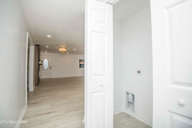 corridor with light hardwood / wood-style flooring