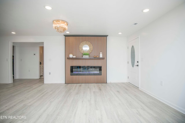 unfurnished living room featuring light hardwood / wood-style flooring