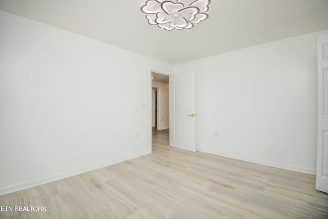 empty room with light hardwood / wood-style floors