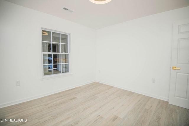 empty room with light hardwood / wood-style floors