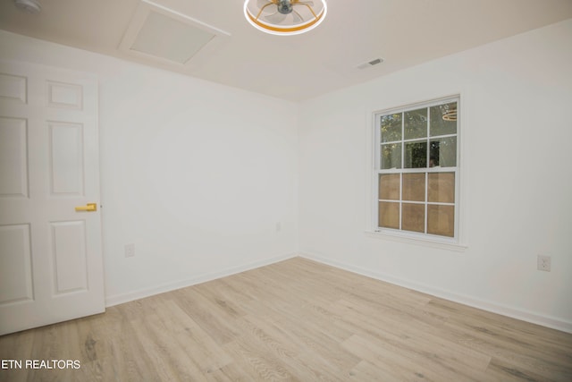 empty room with light hardwood / wood-style flooring