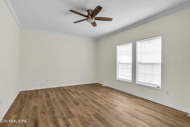 spare room with ornamental molding, wood-type flooring, and ceiling fan