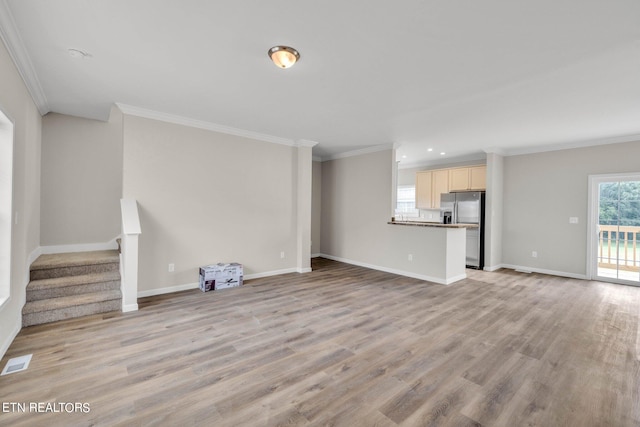 unfurnished living room with light hardwood / wood-style flooring and ornamental molding