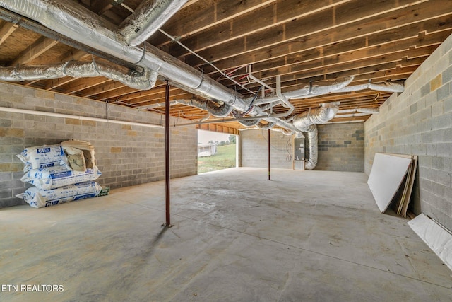 basement featuring electric panel