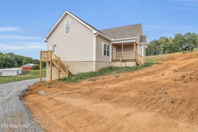 view of home's exterior with covered porch