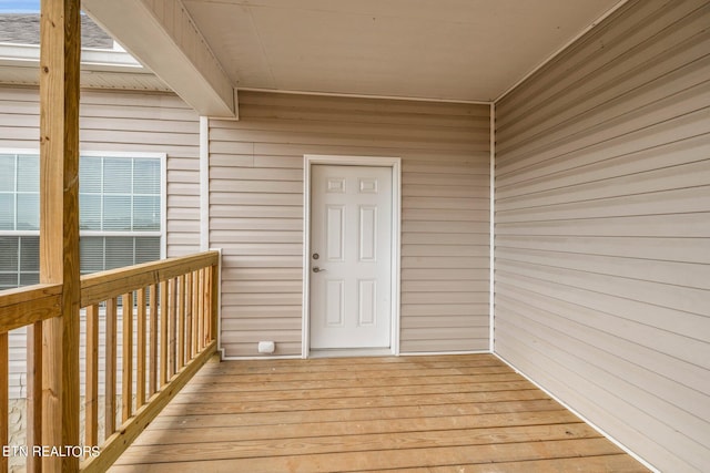 doorway to property featuring a wooden deck