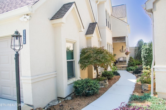 view of property exterior featuring a garage