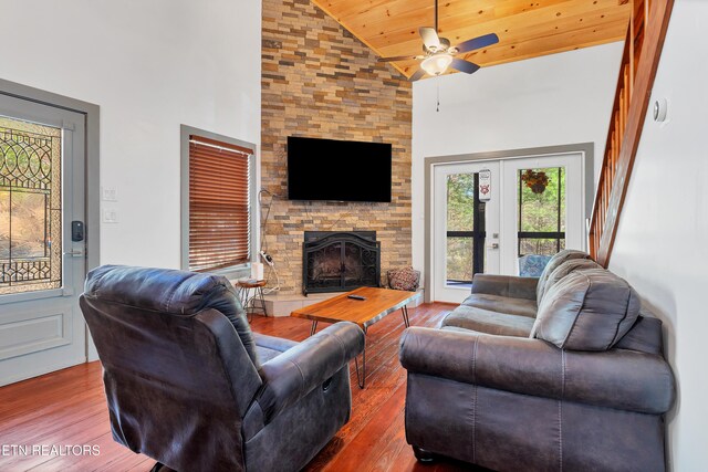 516 Clearwater Cir, Townsend, TN 37882 - living area featuring wood finished floors, a ceiling fan, high vaulted ceiling, a fireplace, and wood ceiling