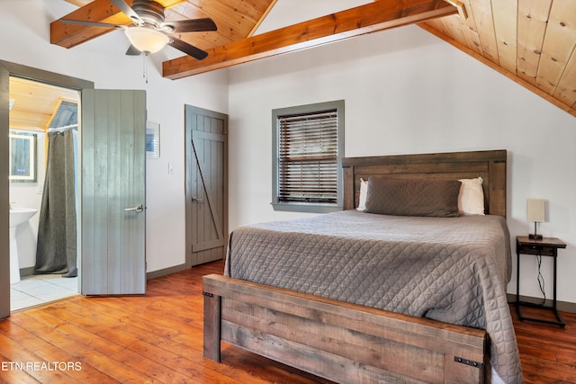 bedroom with vaulted ceiling with beams, light wood-type flooring, and ceiling fan