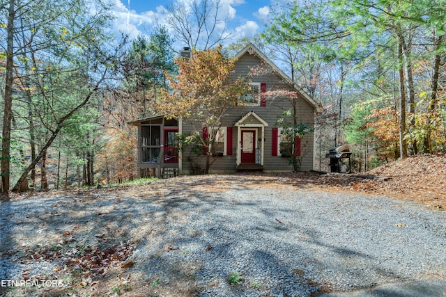 516 Clearwater Cir, Townsend, TN 37882 - view of front of house featuring a sunroom and a chimney