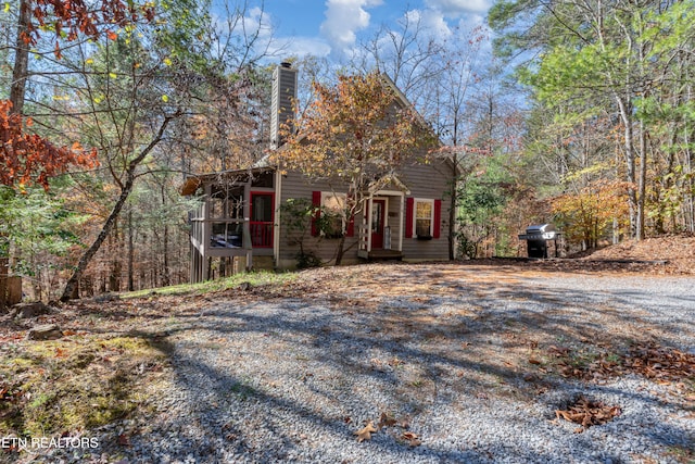 obstructed view of property with a sunroom