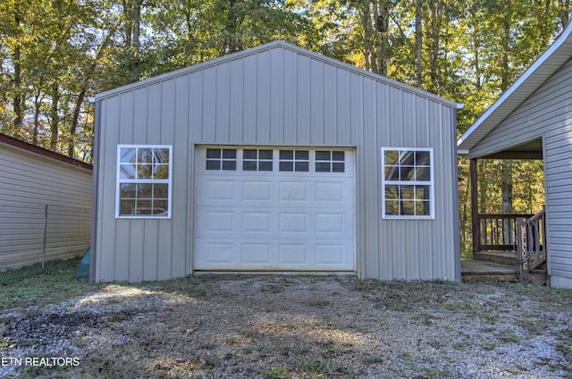 garage featuring wooden walls