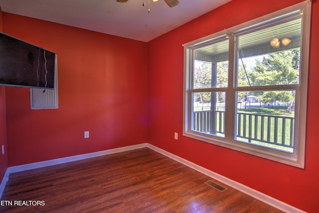 empty room with ceiling fan and wood-type flooring