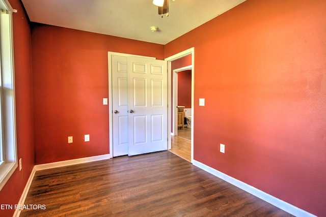 unfurnished bedroom featuring dark hardwood / wood-style floors