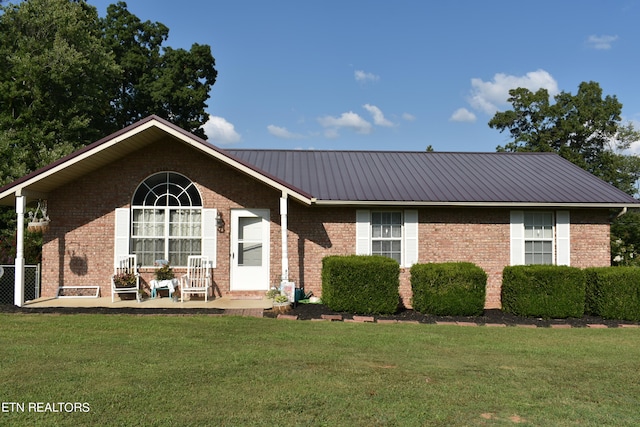 ranch-style home with a front lawn