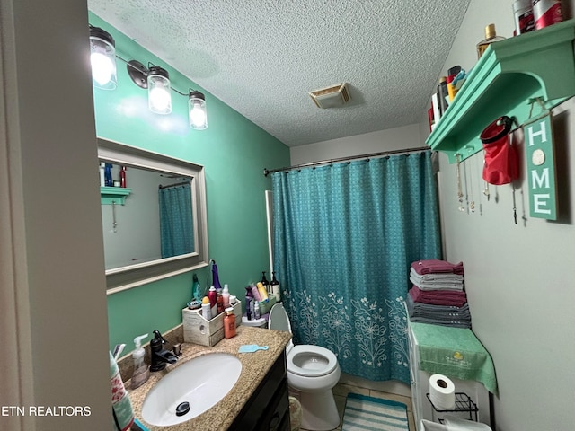 bathroom featuring vanity, a shower with shower curtain, a textured ceiling, and toilet