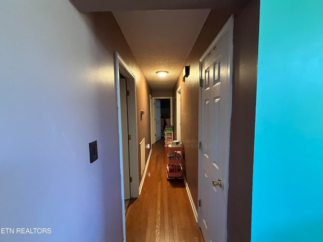 hallway featuring hardwood / wood-style floors