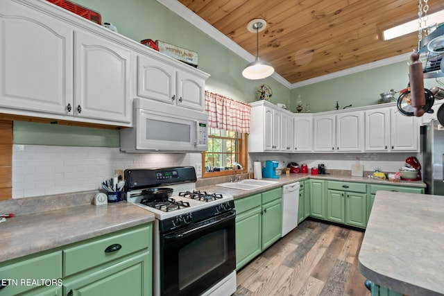 kitchen featuring white appliances, wood-type flooring, sink, white cabinetry, and crown molding