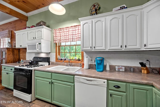 kitchen featuring sink, white cabinets, and white appliances