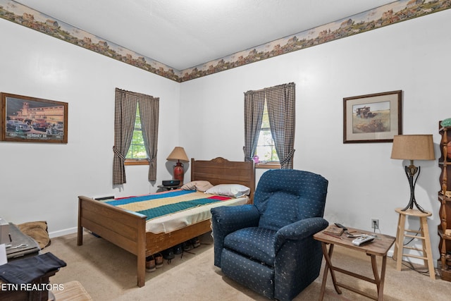 bedroom featuring light colored carpet