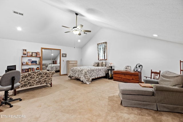 carpeted bedroom with lofted ceiling and ceiling fan