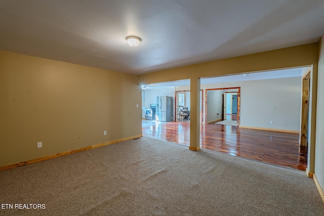 unfurnished room featuring wood-type flooring