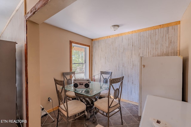 dining space with wooden walls