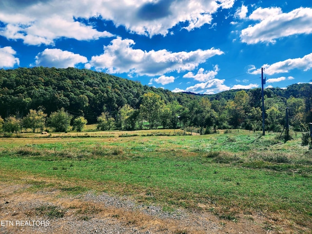 property view of mountains featuring a rural view